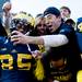 Michigan wide receiver Joe Reynolds, left, celebrates and takes a picture with fans after a football game at Michigan Stadium on Saturday afternoon. Michigan defeated Iowa 42 to 17.
Joseph Tobianski | AnnArbor.com